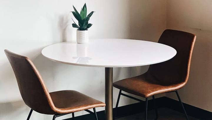 oval white wooden table with chairs